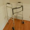 Rolling walker (rollator) with seat and hand brakes