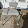 Shower bench with adjustable back rest and padded arms