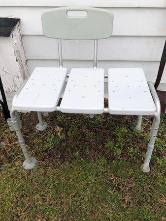 Shower bench with adjustable back rest and padded arms